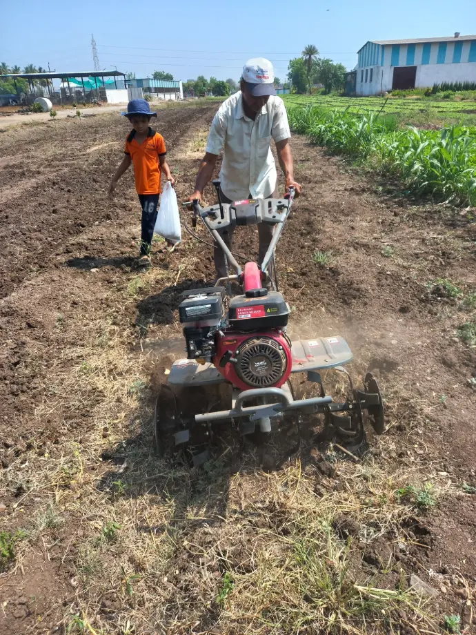 Pratham working on the farm